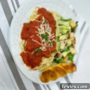 Slow cooker spaghetti sauce, rich and simmering, ready to be tossed with pasta