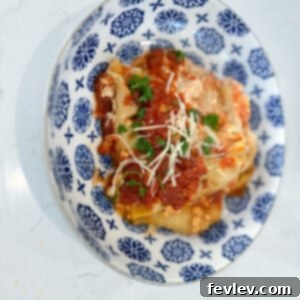 Slow cooker vegetarian lasagna, layered with rich sauce, pasta, and cheeses