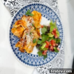 Slow Cooker Ravioli Casserole, cheesy and bubbling, ready to be enjoyed