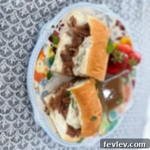 Classic Slow Cooker French Dip Sandwiches, with tender beef and a side of au jus