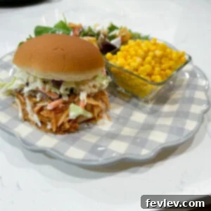 Classic Slow Cooker BBQ Chicken, shredded and coated in a rich, smoky barbecue sauce