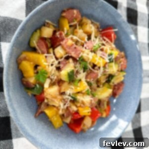 Sausage and potatoes with vibrant summer vegetables, a healthy and delicious meal