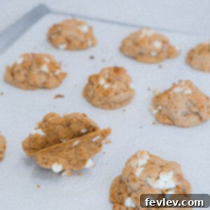 Delicious Biscoff White Chocolate Chip Cookies arranged on a cooling rack.
