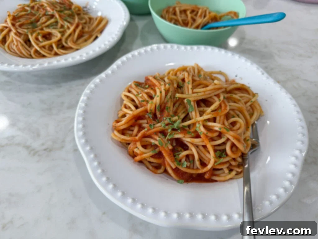 Feast for a Month: $45 Budget Dinners and Savvy Grocery Secrets 15 A simple plate of spaghetti topped with rich red sauce, ready for a budget-friendly and satisfying dinner.