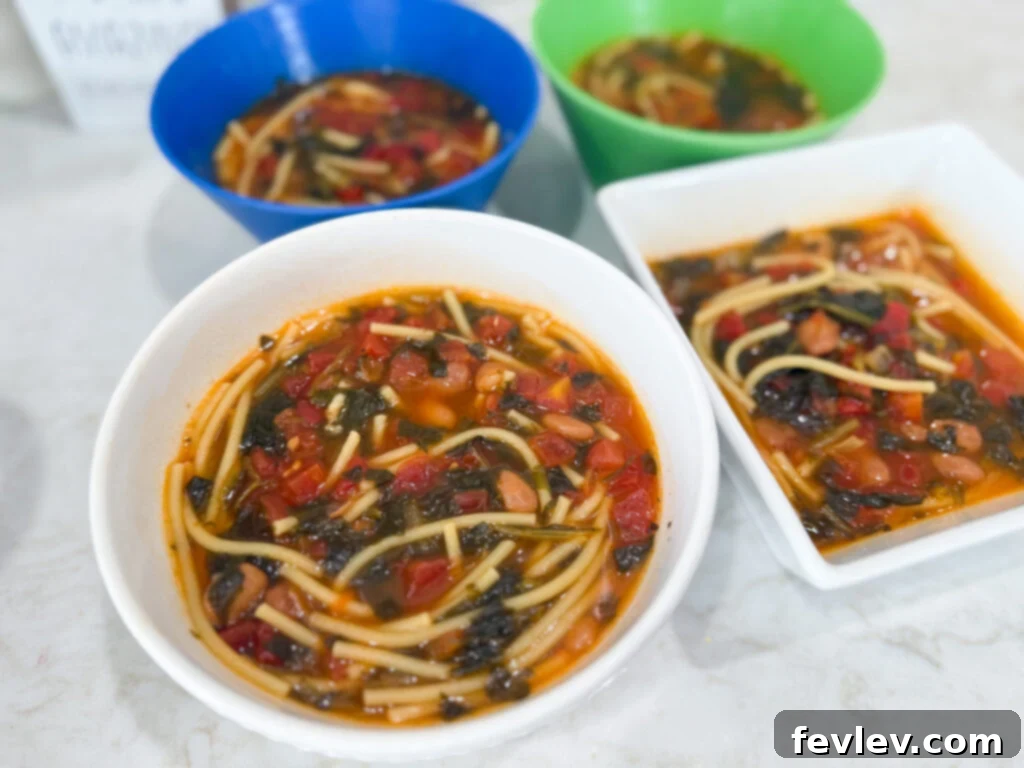 Feast for a Month: $45 Budget Dinners and Savvy Grocery Secrets 16 A hearty bowl of spaghetti bean soup, with visible pieces of spaghetti and vegetables, a warming and economical meal.