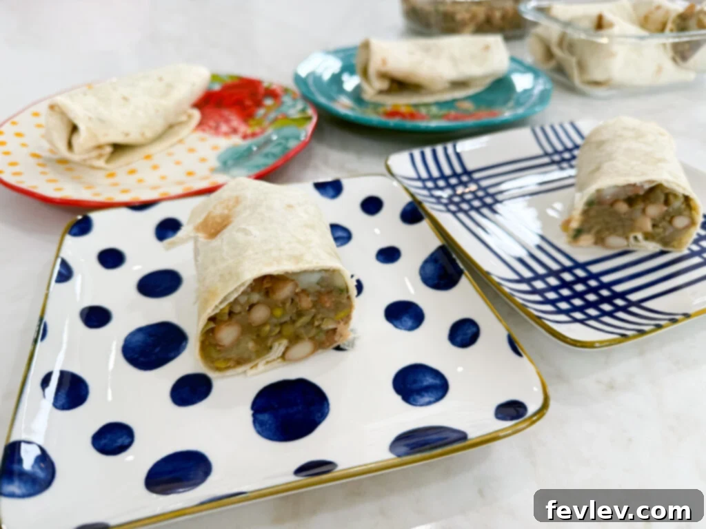 Feast for a Month: $45 Budget Dinners and Savvy Grocery Secrets 20 Homemade chicken pinto bean burritos, generously filled and ready to eat, a customizable and affordable meal solution.