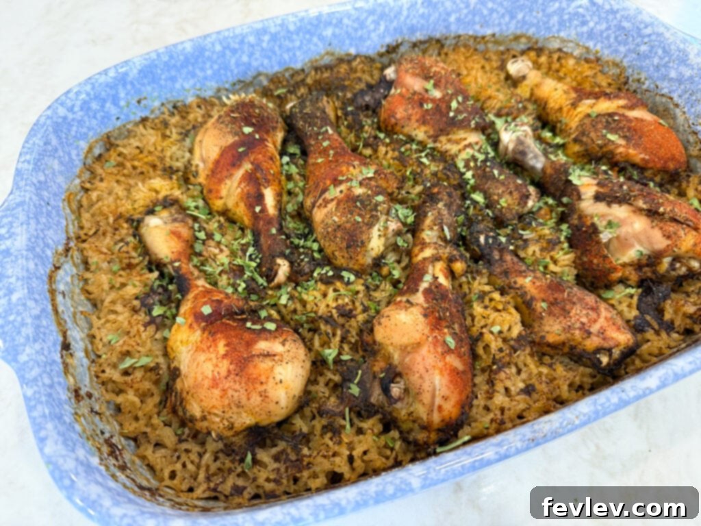 Feast for a Month: $45 Budget Dinners and Savvy Grocery Secrets 5 A warm, bubbling seasoned chicken and rice casserole, fresh from the oven, offering a comforting budget meal.
