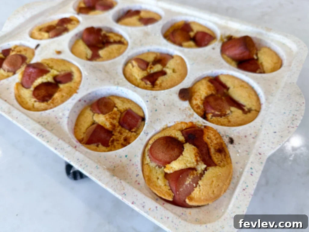 Feast for a Month: $45 Budget Dinners and Savvy Grocery Secrets 9 Golden brown corn dog muffins, baked in a muffin tin with hot dog pieces, a playful and economical dinner.
