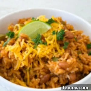 Delicious Spanish Rice with Pinto Beans, presented in a circular image