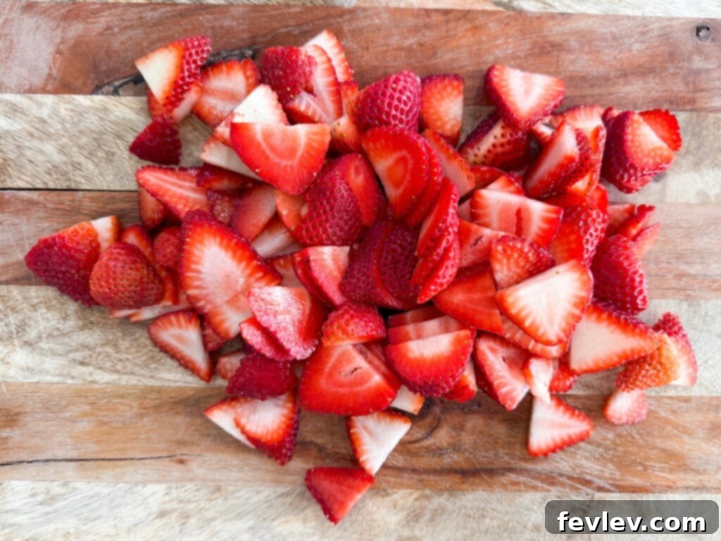 First layer of whipped topping spread in a baking dish for a strawberry icebox cake