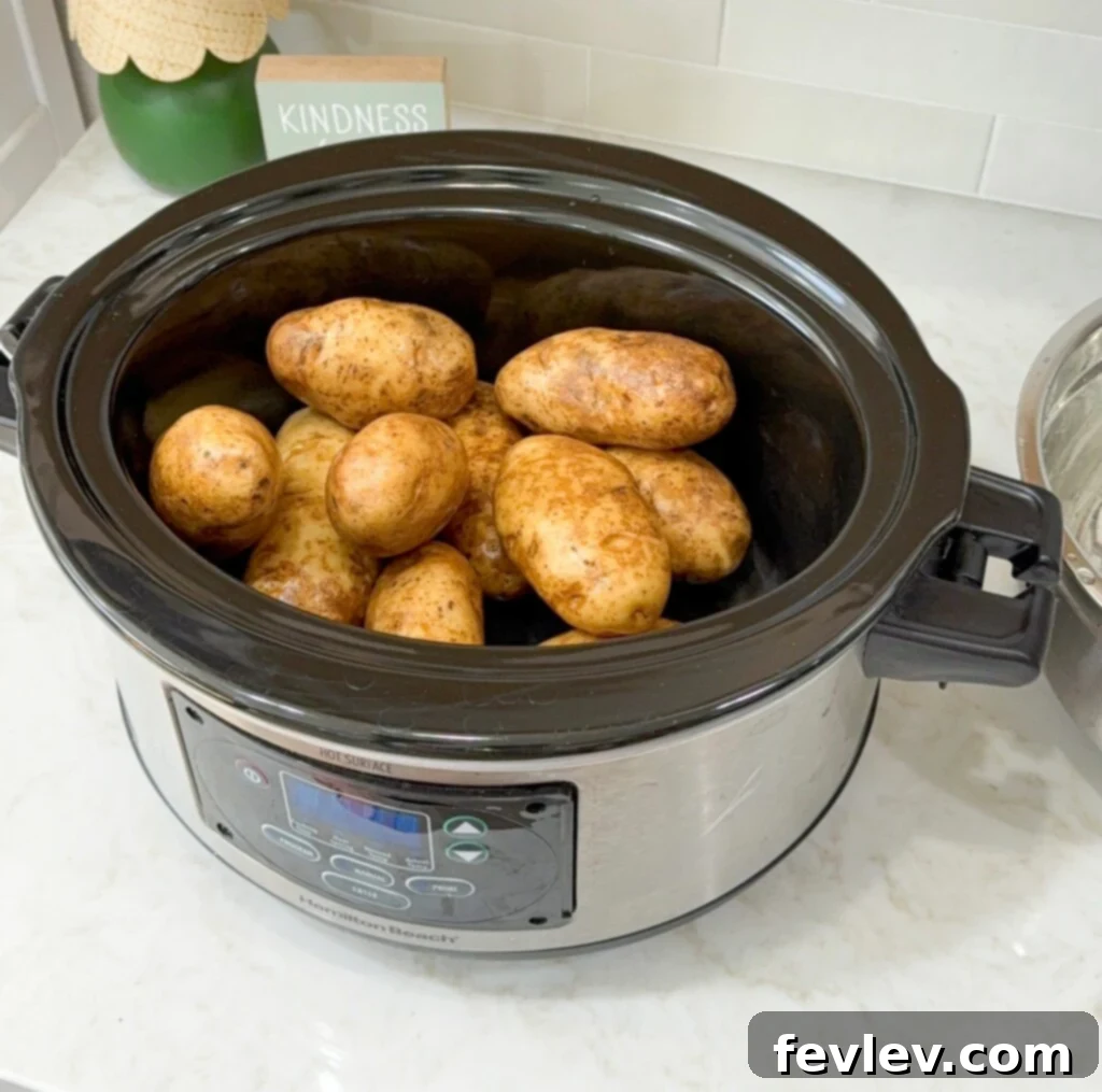washed and prepared russet potatoes ready for the slow cooker