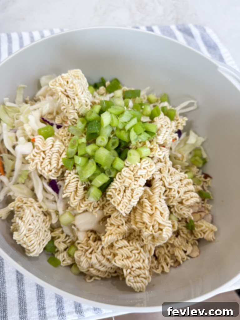 Zesty Ramen Noodle Salad 5 add the ramen ingredients to the bowl