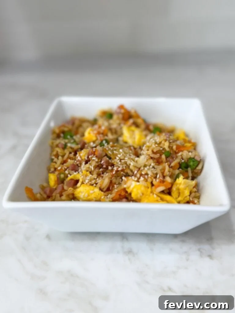 Quick and Delicious Ham Fried Rice 11 Close-up of flavorful ham fried rice with steam rising