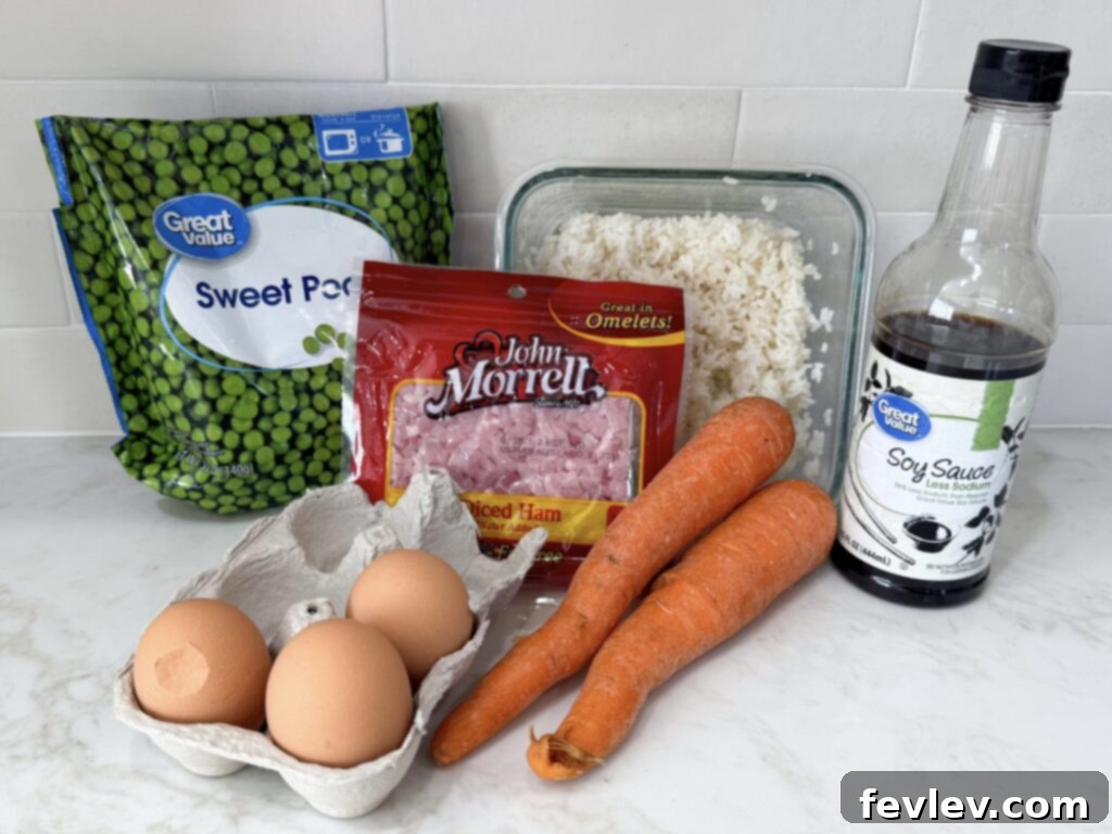 Quick and Delicious Ham Fried Rice 3 Ingredients for ham fried rice laid out on a table