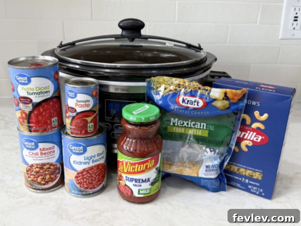 A colorful array of simple ingredients for making Meatless Chili Mac, including beans, tomatoes, and spices.