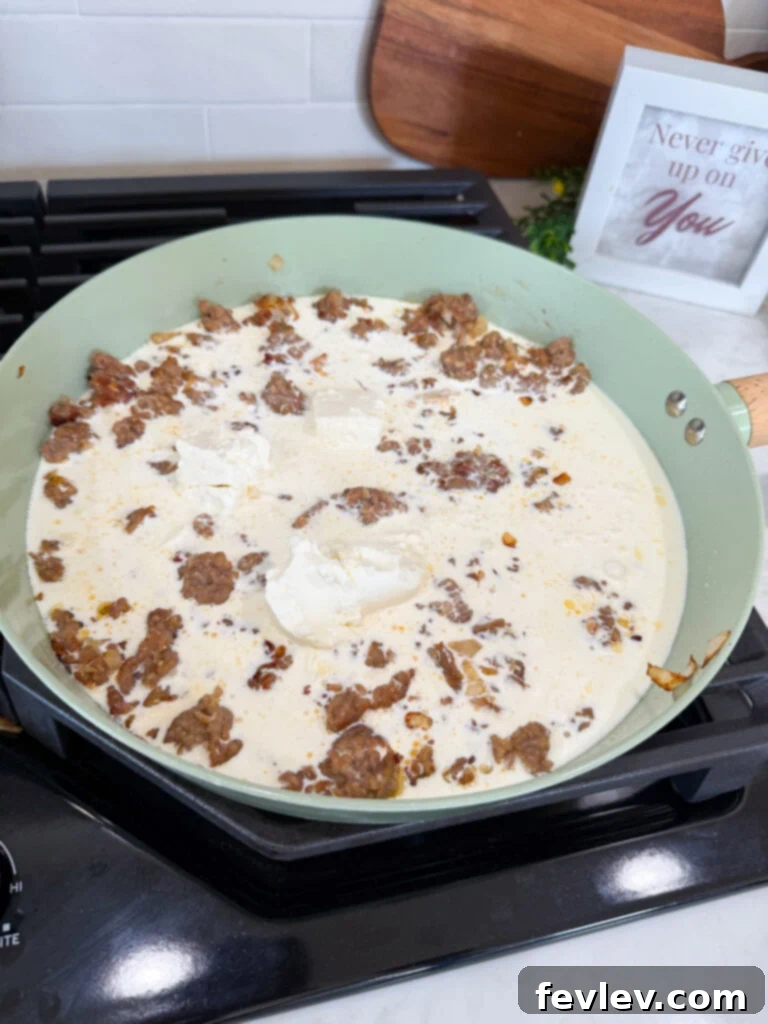 Heavy cream and cream cheese added to Italian sausage for sauce