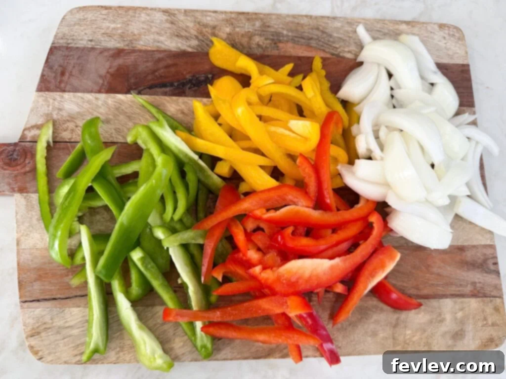 Easy One-Pan Sausage and Peppers 6 Prep peppers and onions, sliced into strips and half-moons.