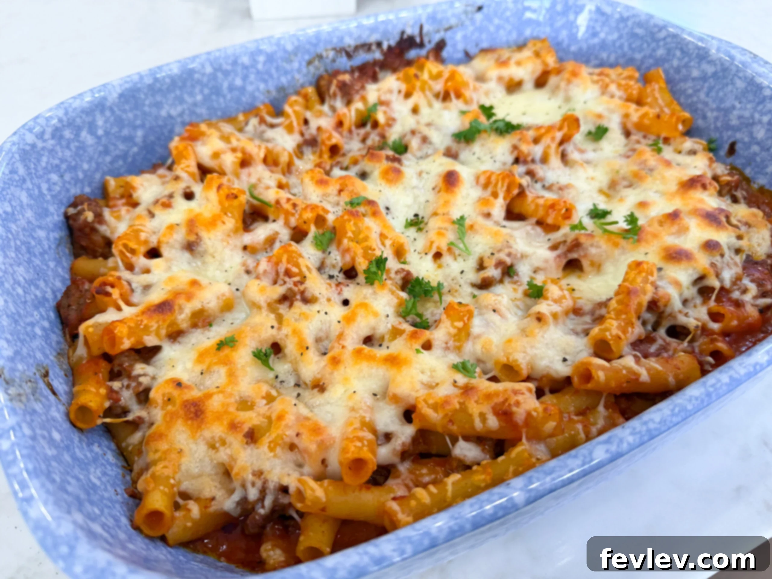 The best baked ziti with Italian sausage and melty cheese