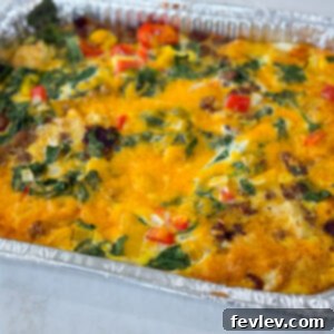 A bubbling Sausage, Hash Brown, and Egg Casserole, ready to serve.