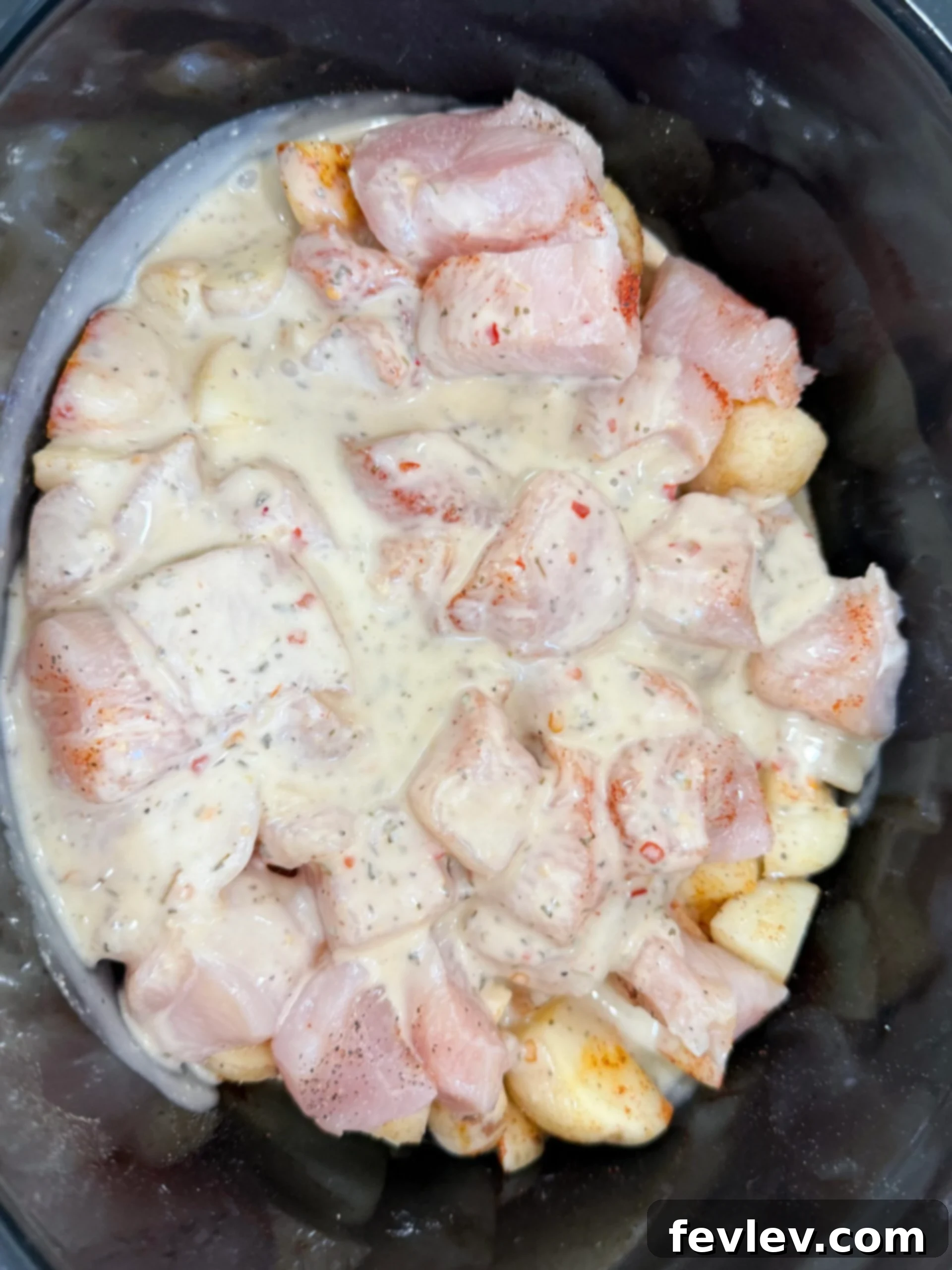 Parmesan Garlic Chicken and Potato Slow Cooker 7 raw chicken with parmesan mixture over top in slow cooker