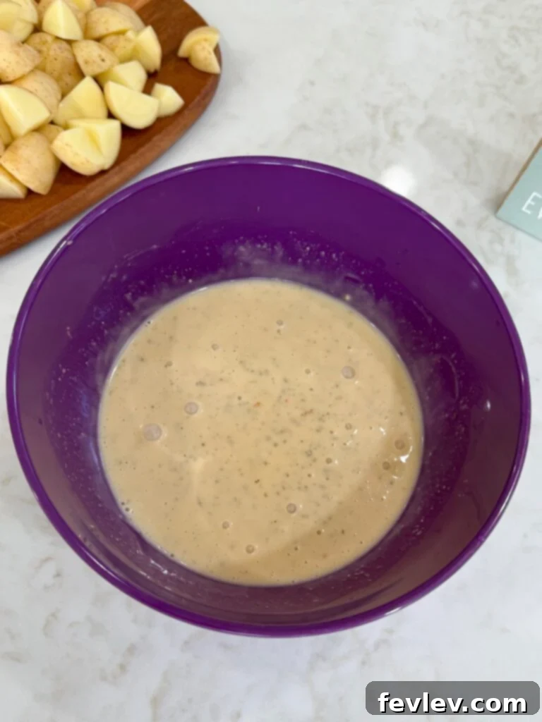 Parmesan Garlic Chicken and Potato Slow Cooker 8 Parmesan mixture in a purple bowl on a white counter