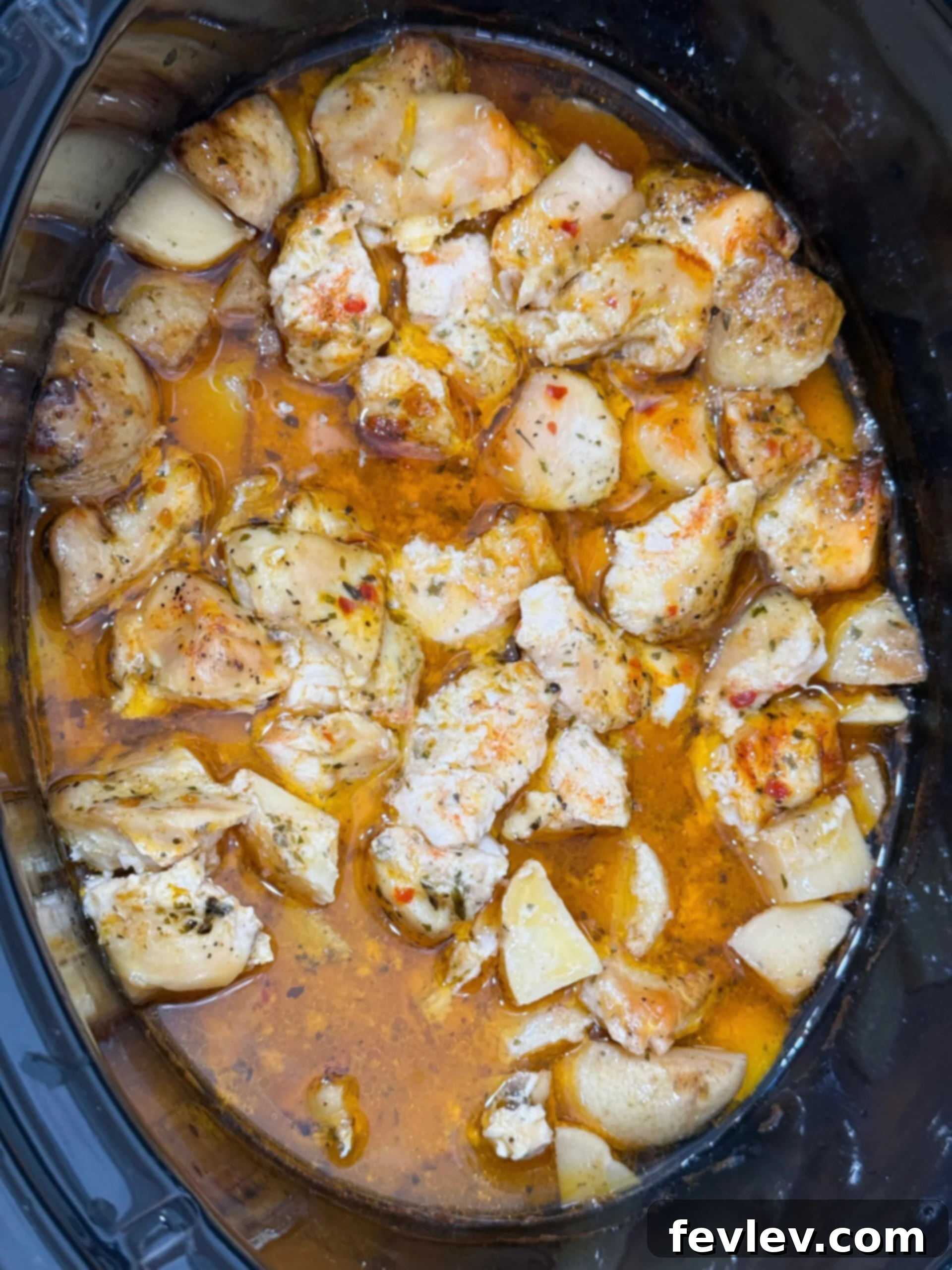 Parmesan Garlic Chicken and Potato Slow Cooker 9 Cooked chicken in a garlic parmesan sauce in the slow cooker