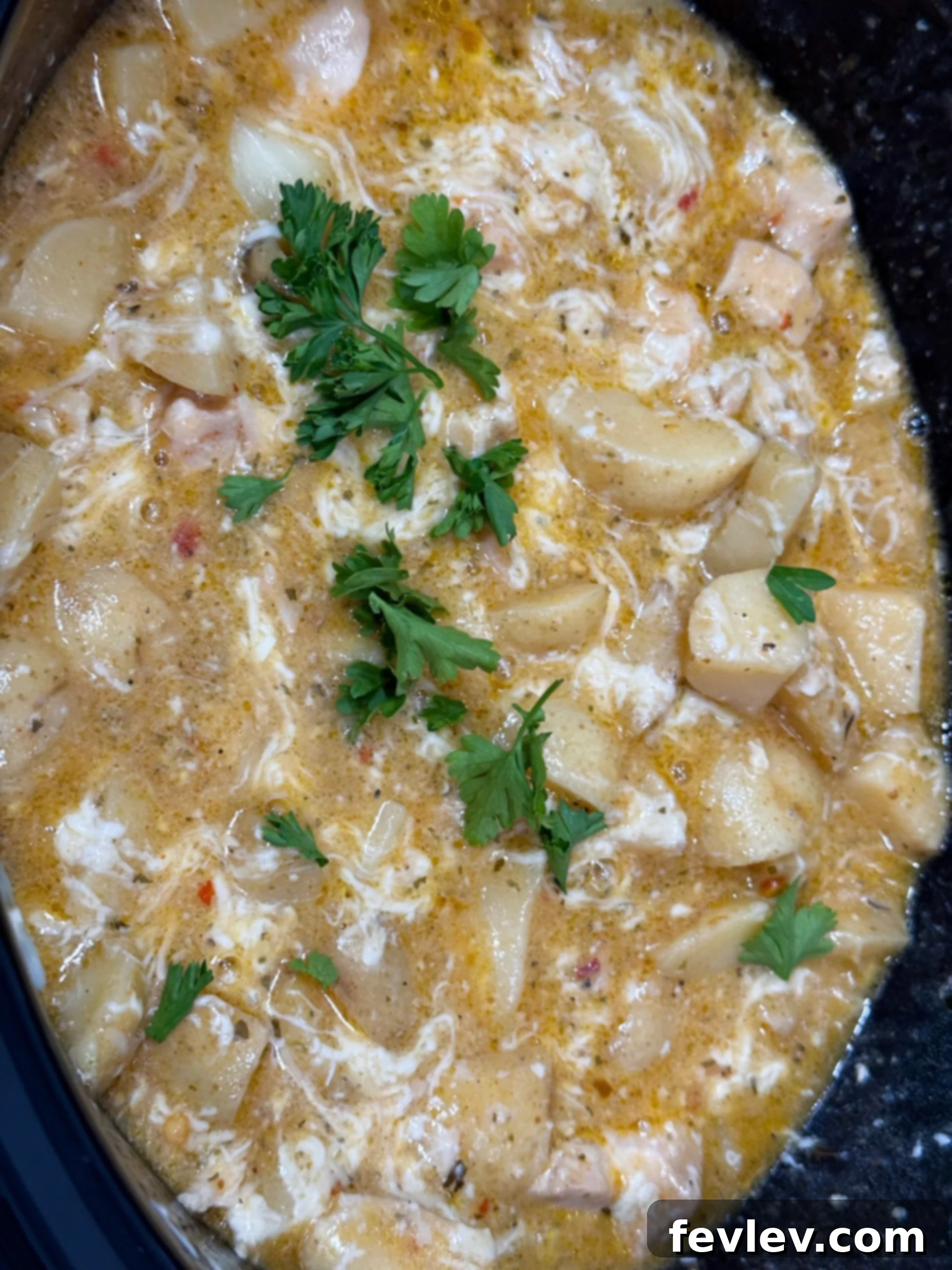 Parmesan Garlic Chicken and Potato Slow Cooker 10 creamy parmesan sauce with cooked chicken and fresh parsley