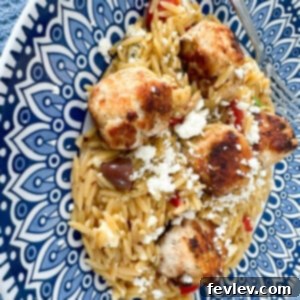 Greek meatballs with orzo, a gourmet-tasting yet approachable meal featuring feta-stuffed turkey meatballs served with lemony orzo, olives, and dill.