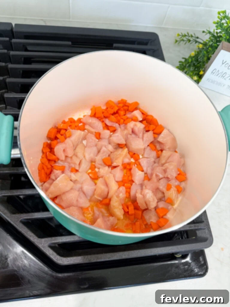 Step 1: Sautéing chicken, carrots, and onions in a pan with butter until tender and lightly browned.