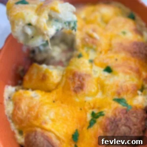 Golden brown cheesy chicken crescent roll casserole baked in a pan