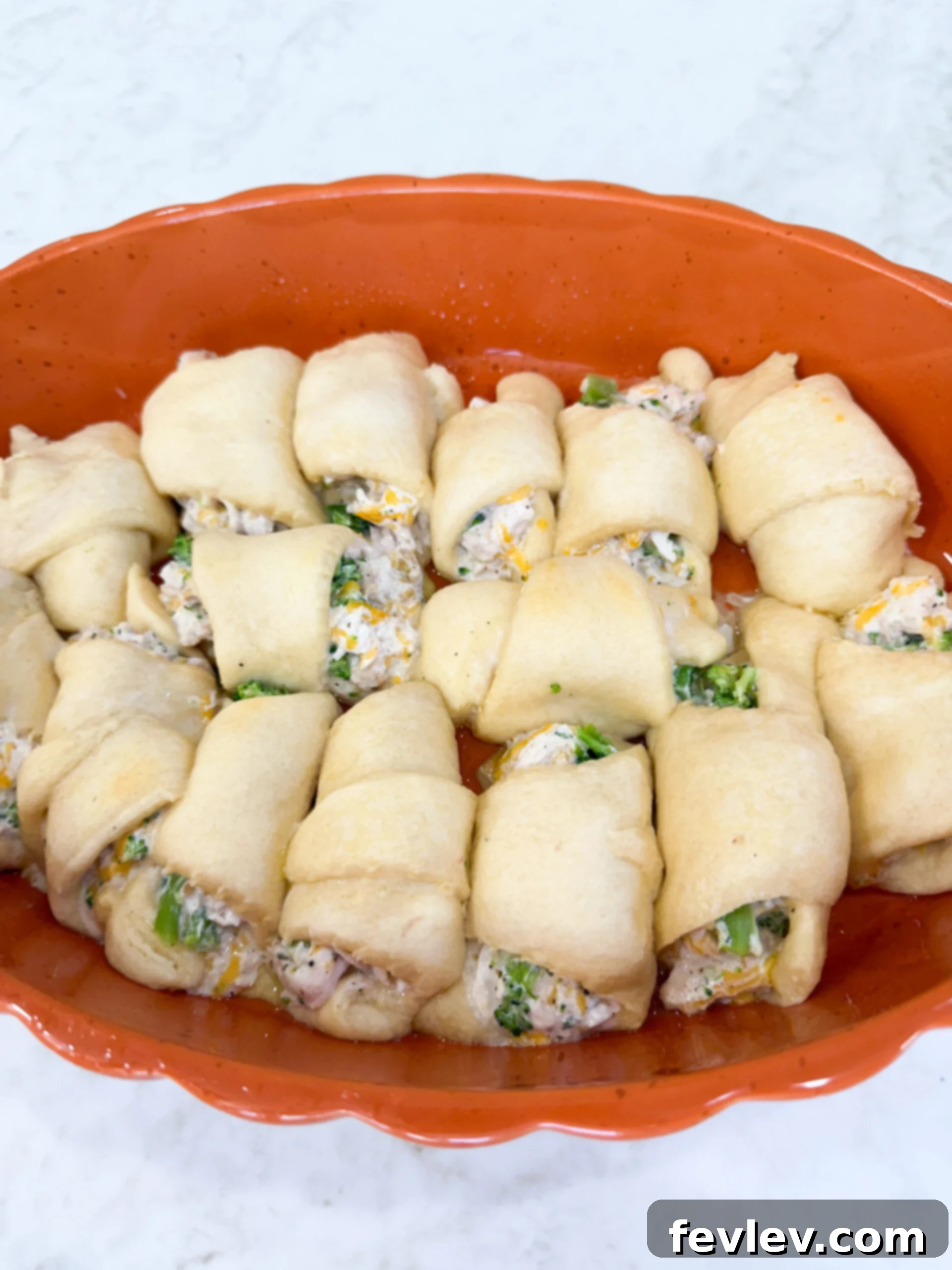 Chicken crescent rolls arranged in greased 9x13 pan