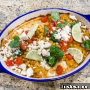 Juicy Street Corn Chicken topped with creamy elote-style corn, lime, and chili