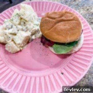Delicious, juicy homemade hamburger patty on a grill