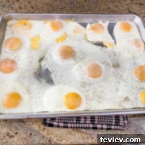 Delicious Easy Sheet Pan Eggs, perfect for meal prepping breakfast or feeding a crowd. Baked to golden perfection on a sheet pan.