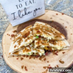 Delicious and crispy breakfast quesadilla with eggs, cheese, and bacon