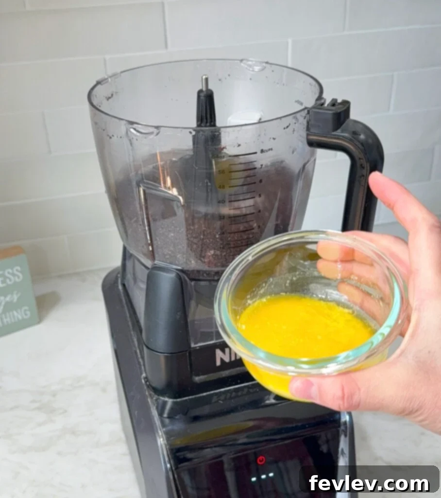 Melted butter combined with Oreo crumbs