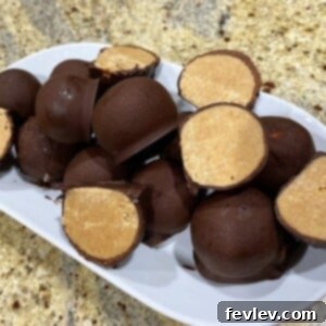 Delicious chocolate-dipped peanut butter balls arranged on a serving platter.