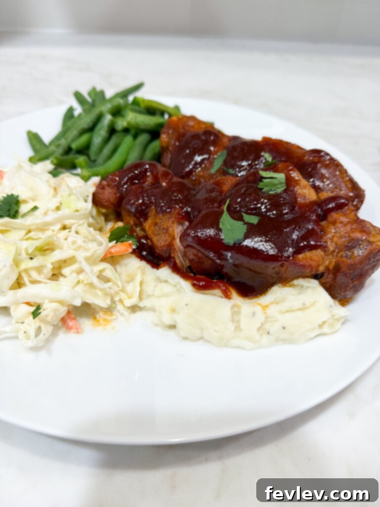 Prime Pork Rib Cut 6 Plated boneless pork ribs drizzled with extra sauce and garnish
