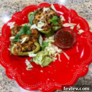 Delicious baked Taco Stuffed Peppers garnished with fresh cilantro