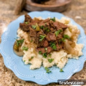 Delicious Slow Cooker Beef Tips with Rich Gravy, ready to serve over mashed potatoes