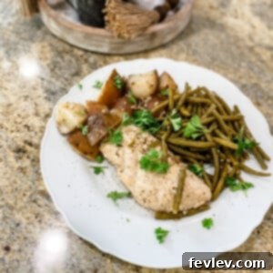 Delicious Slow Cooker Seasoned Chicken and Vegetables with tender potatoes and crisp green beans, cooked to perfection.