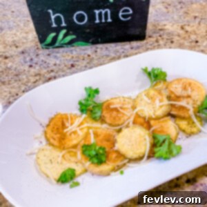 Crispy homemade microwave potato chips seasoned with herbs, arranged on a plate