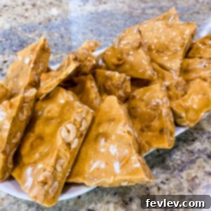 Delicious Microwave Peanut Brittle on a serving platter