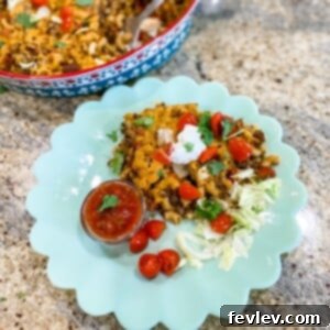 Cheesy Taco Pasta, a delicious and easy one-pot meal with ground beef, pasta, Rotel, and cheddar cheese.