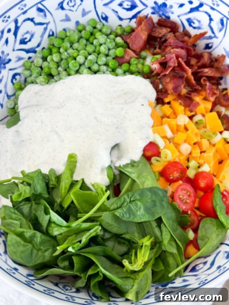 Ultimate Bacon Ranch Pasta 5 Combining cooled pasta, crumbled bacon, cheese, and fresh vegetables with ranch dressing