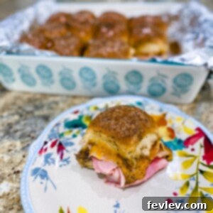 Delicious Hawaiian Sliders with ham, turkey, and melted cheese