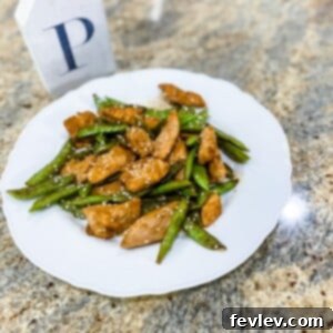 Delicious Honey Garlic Chicken with vibrant sugar snap peas, served as a quick and flavorful weeknight meal