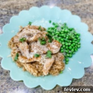 Delicious Parmesan Garlic Chicken and Rice in a skillet, garnished with fresh parsley.
