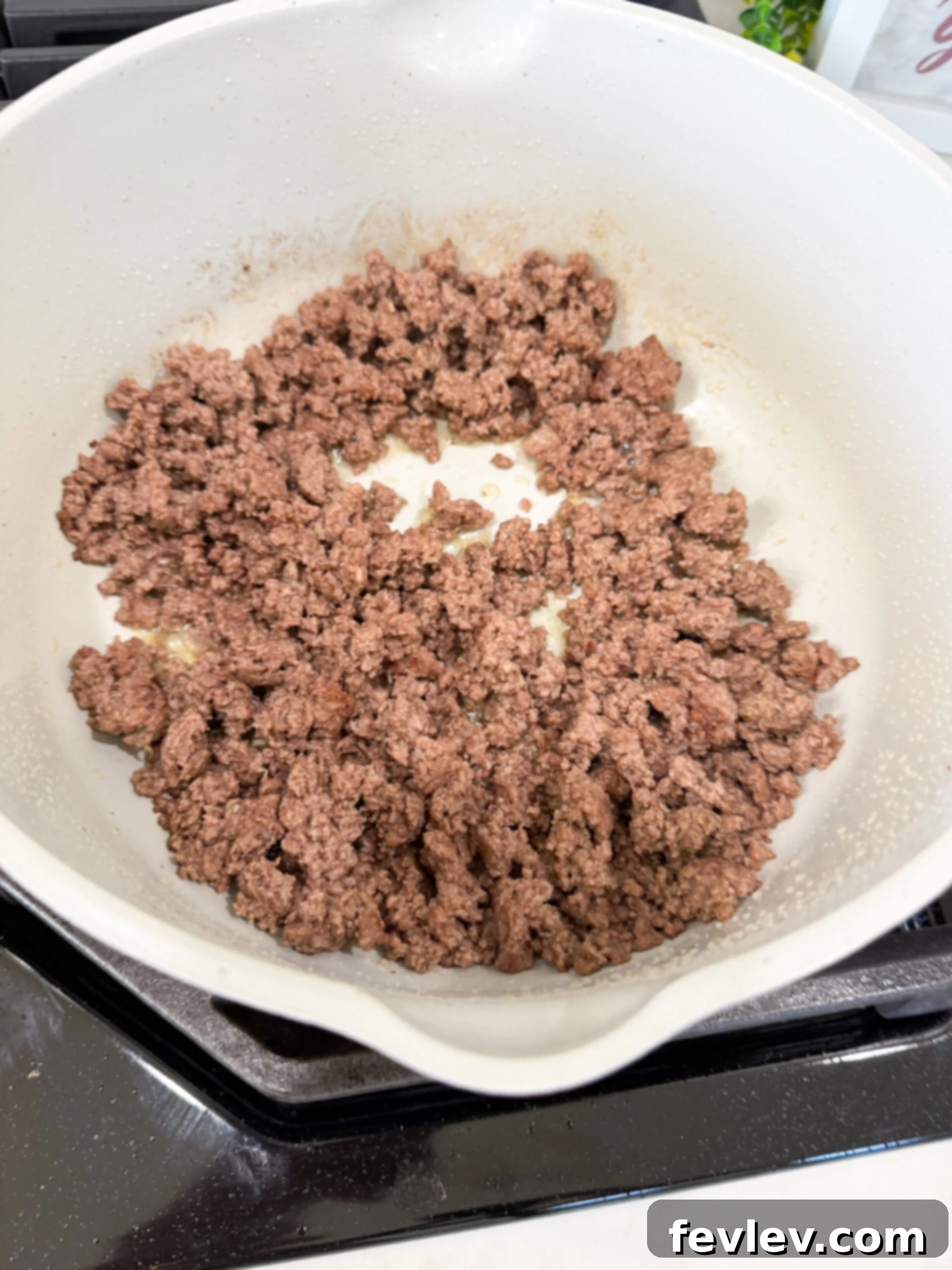 Ground beef browning in a large pot, an essential first step for our One-Pot Taco Pasta.