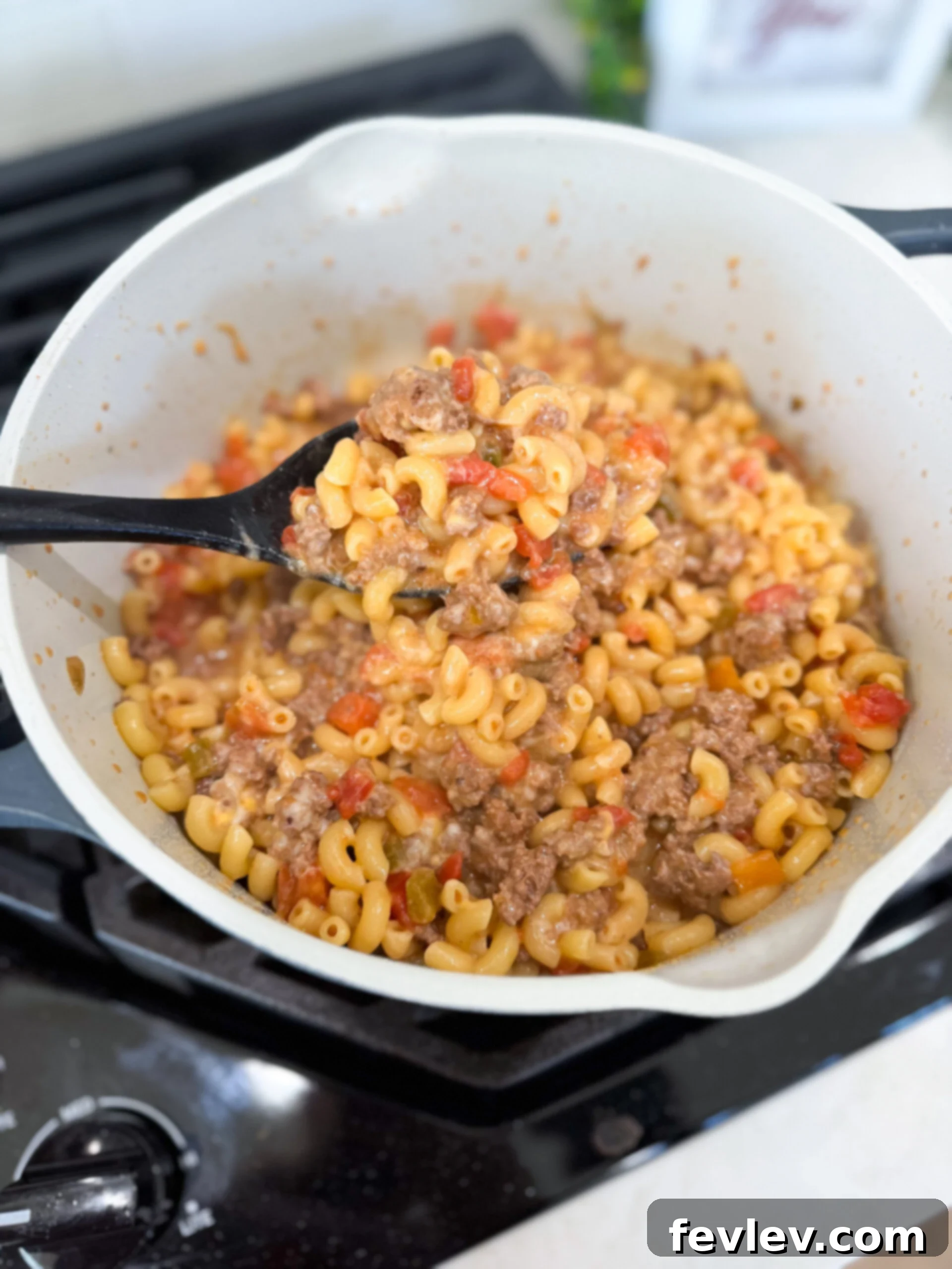 The final delicious cooked taco pasta, piping hot and ready to be served, garnished with fresh cilantro.